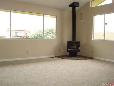 The freestanding fireplace adds ambiance.