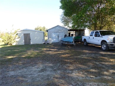 2 OF THE 4 STORAGE BUILDINGS CONCRETE FLOORS 21 X 