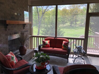 This is an upgrade and feature, enclosed screened-in porch with brick gas fireplace, mantel and ceiling fan. Relax and enjoy!
