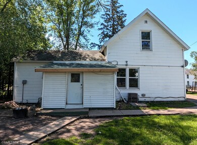 Back of the home. Porch has new shingles