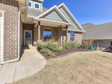 Property entrance with a lawn, a porch, roof with shingles, board and batten siding, and brick siding