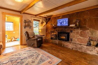 Living room with a fireplace, a healthy amount of