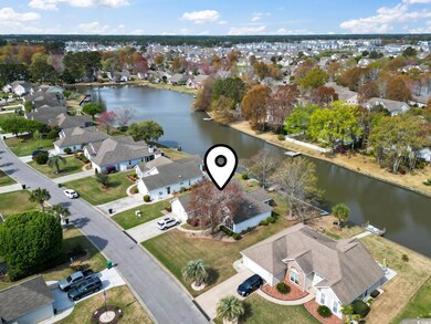 Aerial view with a water view and a residential vi