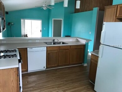 Open concept kitchen with all the appliances and a