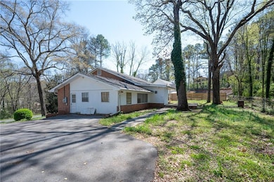 View of property exterior featuring brick siding, 