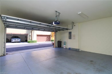 Garage with a garage door opener and electric pane