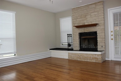 Unfurnished living room featuring wood finished f