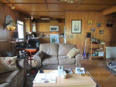 ANOTHER VIEW OF LIVING ROOM LOKING THROUGH TO THE KITCHEN