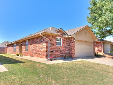 Ranch-style house with a front yard and a garage