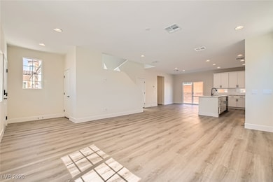 Unfurnished living room featuring light wood-style