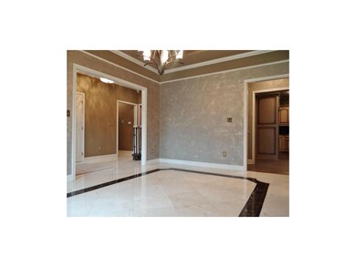 Adjacent to the Formal Dining Room Is the Kitchen.