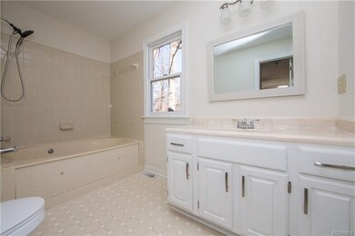 Master Bath with Jetted Tub with new fixtures & vanity, ceramic tile floor.