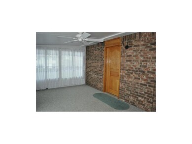 Great All Season Room with Beautiful Brick Wall