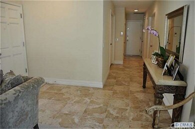 Entrance with custom tiled floors