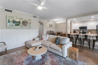 Living room featuring dark tile patterned floors, 