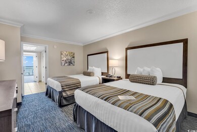 Bedroom featuring a textured ceiling, ornamental m