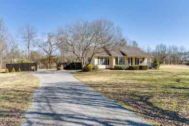 Level gravel drive with plenty of parking in front and in the back through the gate.