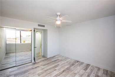 Unfurnished bedroom with a closet, baseboards, vis
