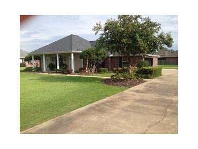 Exterior Front. Long driveway with extra parking f