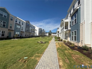 View of community featuring a lawn and a residential view