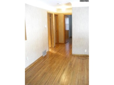 Hallway leads to 3 bedrooms and baths