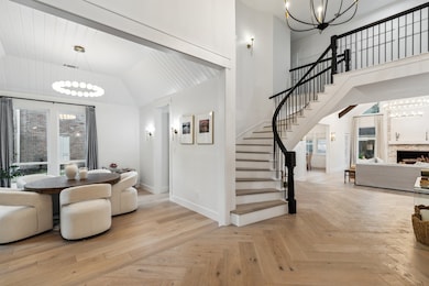 Featuring wood floors throughout with a herringbon