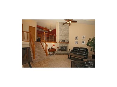 Comfortable living room with tile and carpet floor