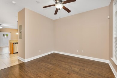 Empty room featuring ceiling fan, electric panel, 