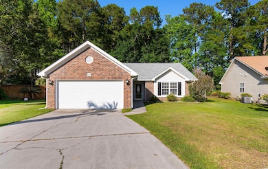 View of front of home featuring brick siding, conc