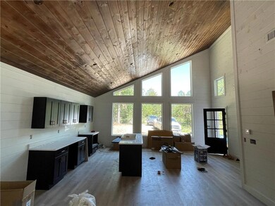 Living room facing kitchen/dining area