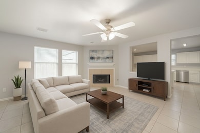 Large living room open to kitchen - virtually staged