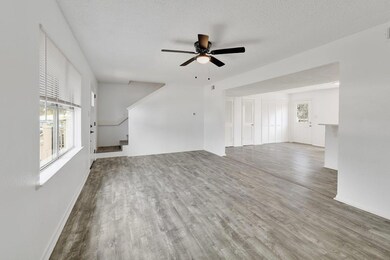 Unfurnished living room featuring wood finished f