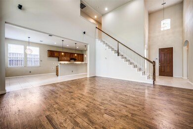 Stairs lead to three bedrooms, two full baths, and