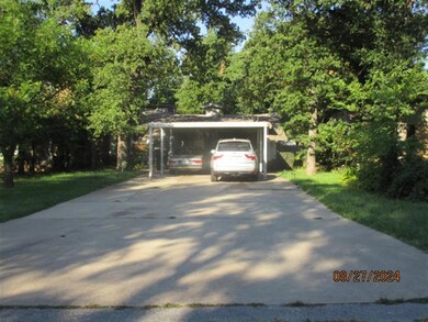 View of front of property with a carport