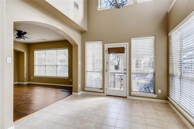 Tiled foyer entrance featuring visible vents, arc