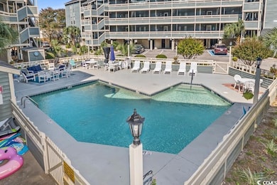 View of swimming pool with a hot tub and a patio a