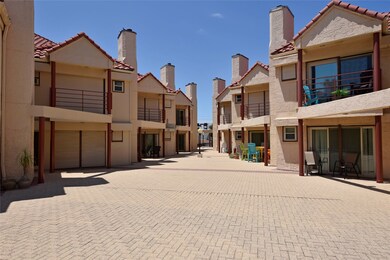 Complex courtyard, see the storm shutters that comes on each unit, behind are double pane, high impact sliding doors to patio or balcony