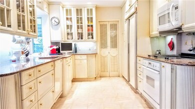Kitchen is wide and there is plenty of countertop.