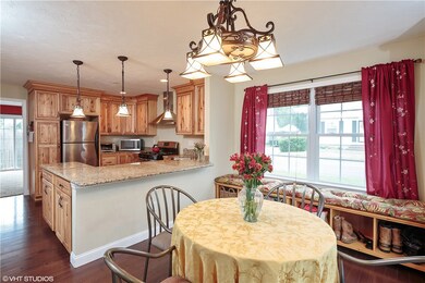 Beautiful Eat-in Kitchen Features Granite Surfaces