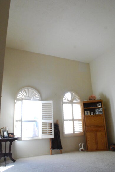 living room with vaulted ceilings