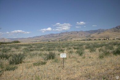 View of mountain backdrop with rural landscape