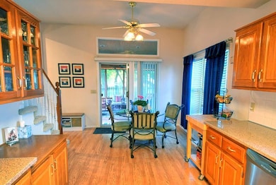 Eat-in kitchen leads to screened in porch