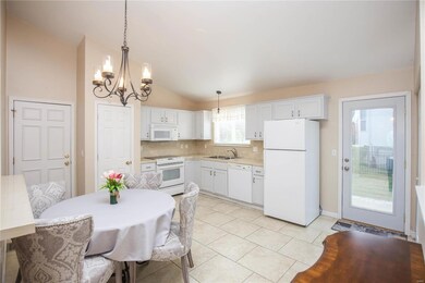 Tile flooring and vaulted ceilings in the kitchen