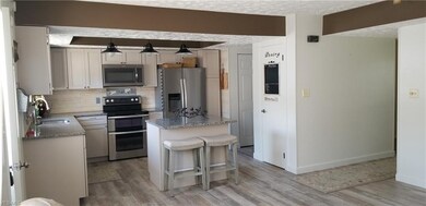 Kitchen with island and pantry.