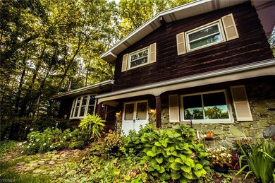 Mature landscaping abounds on this 7 acres of country living.