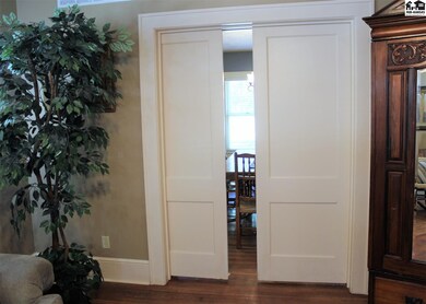 Solid wood pocket doors operate smooth as silk.