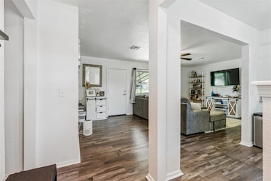 Hallway with wood finished floors