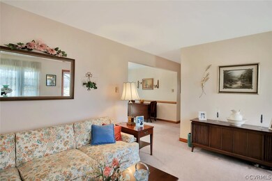 Living room with view into dining room