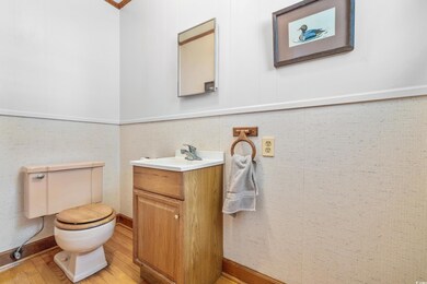 Bathroom featuring hardwood / wood-style floors, v