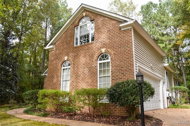 View of side of property featuring a garage